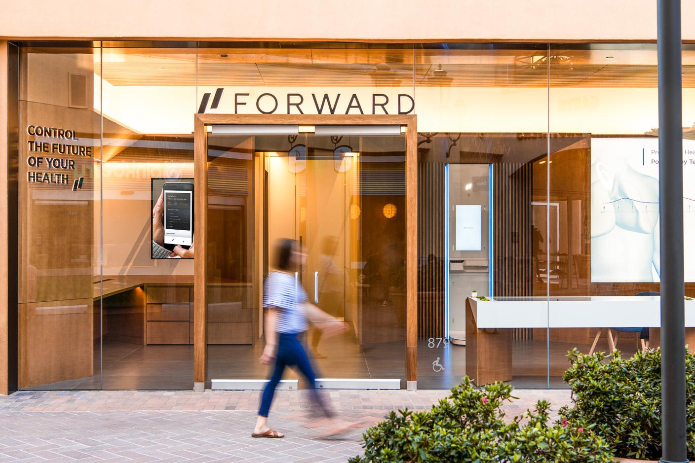 Image showing exterior of a Forward location, a glass building with the Forward logo embedded onto it