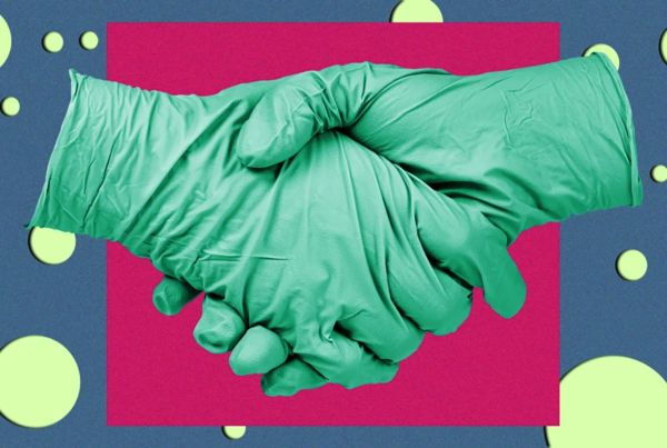 hands in green gloves shake with a red and green background