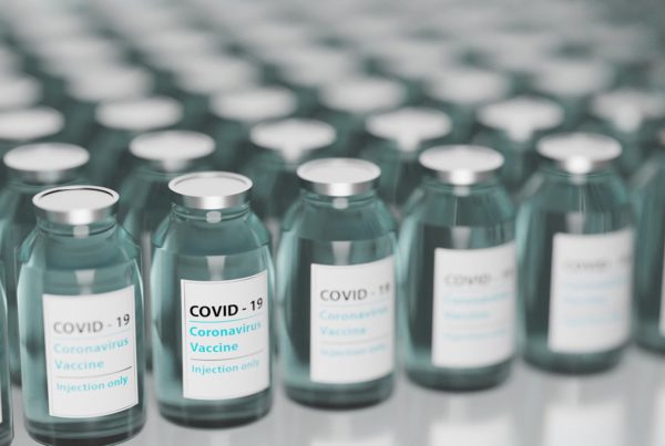vials of COVID-19 coronavirus vaccine arranged in rows